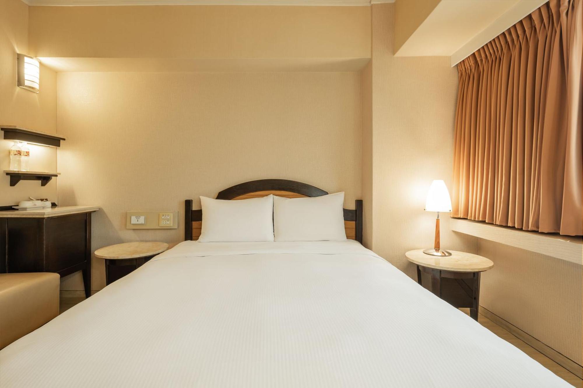 Kindness Hotel Weiwuying Гаосюн Номер фото